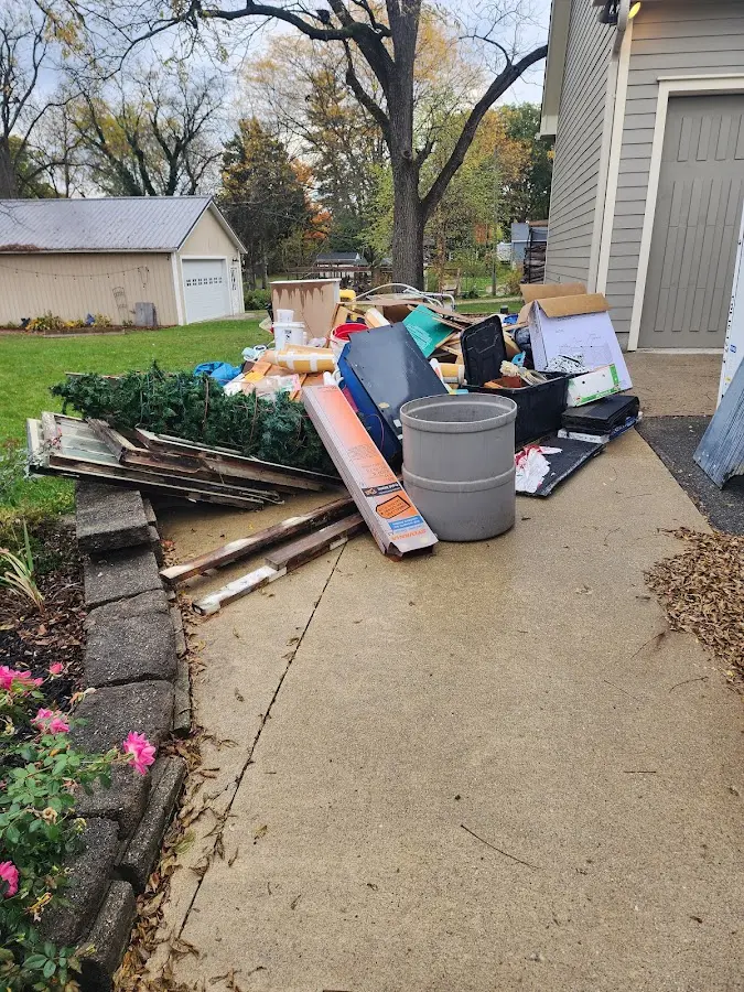 Dumpster being loaded with debris for Commercial Dumpster Rental in Palmview